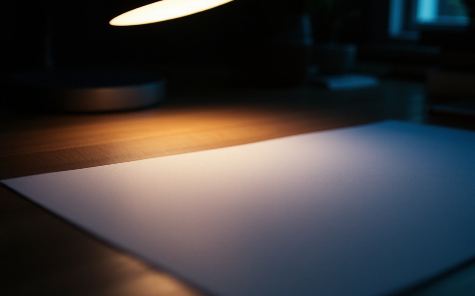 A printed page of plain monospaced text under a desk lamp, macro, one line sharp