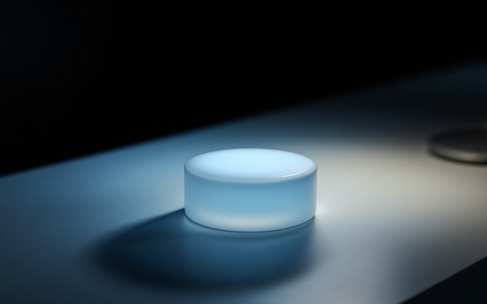 A sealed opaque container on a plain surface